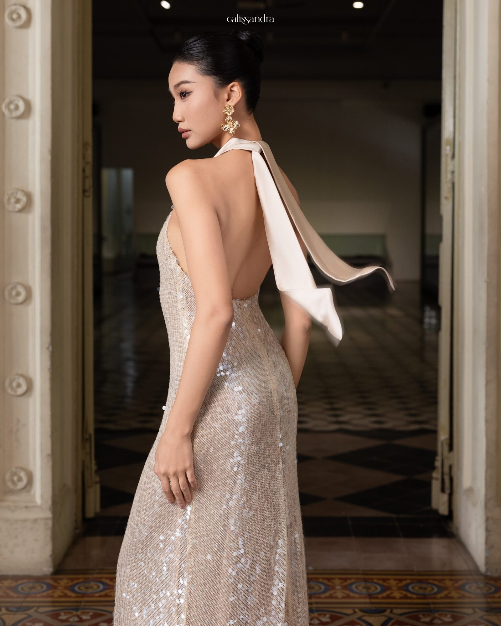 Model wearing the shimmering Calissandra Elissara Dress