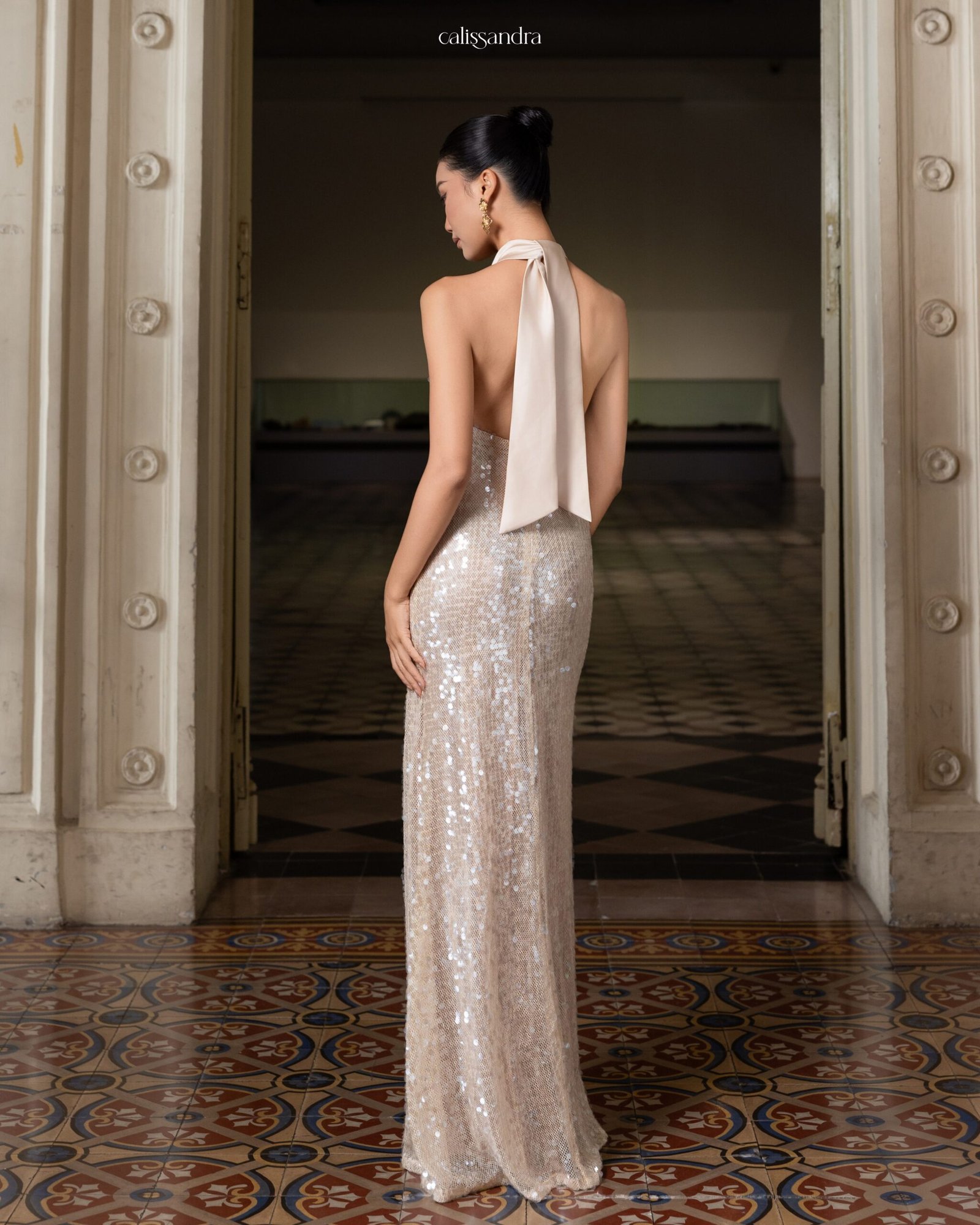 Model wearing the shimmering Calissandra Elissara Dress