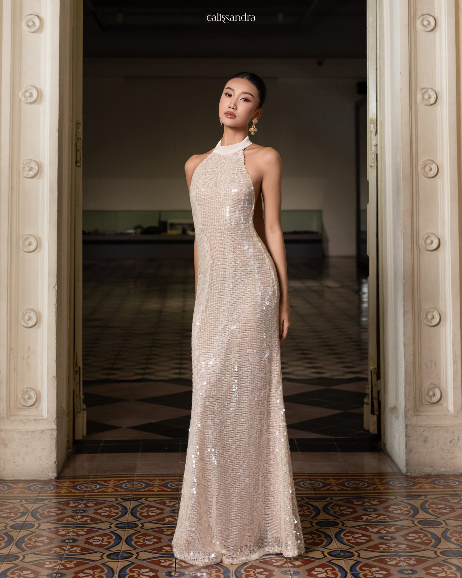 Model wearing the shimmering Calissandra Elissara Dress