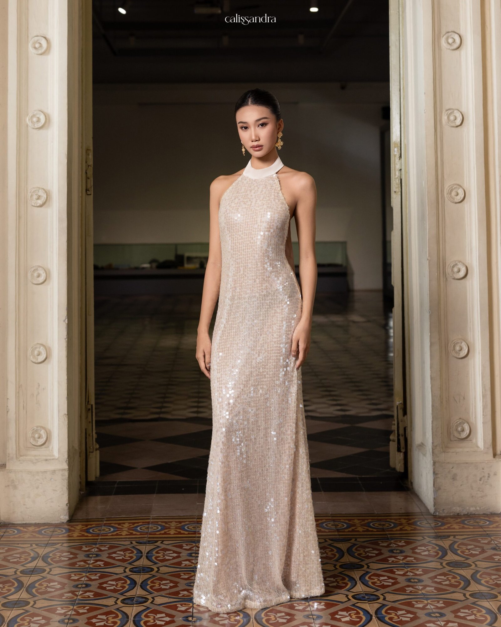 Model wearing the shimmering Calissandra Elissara Dress