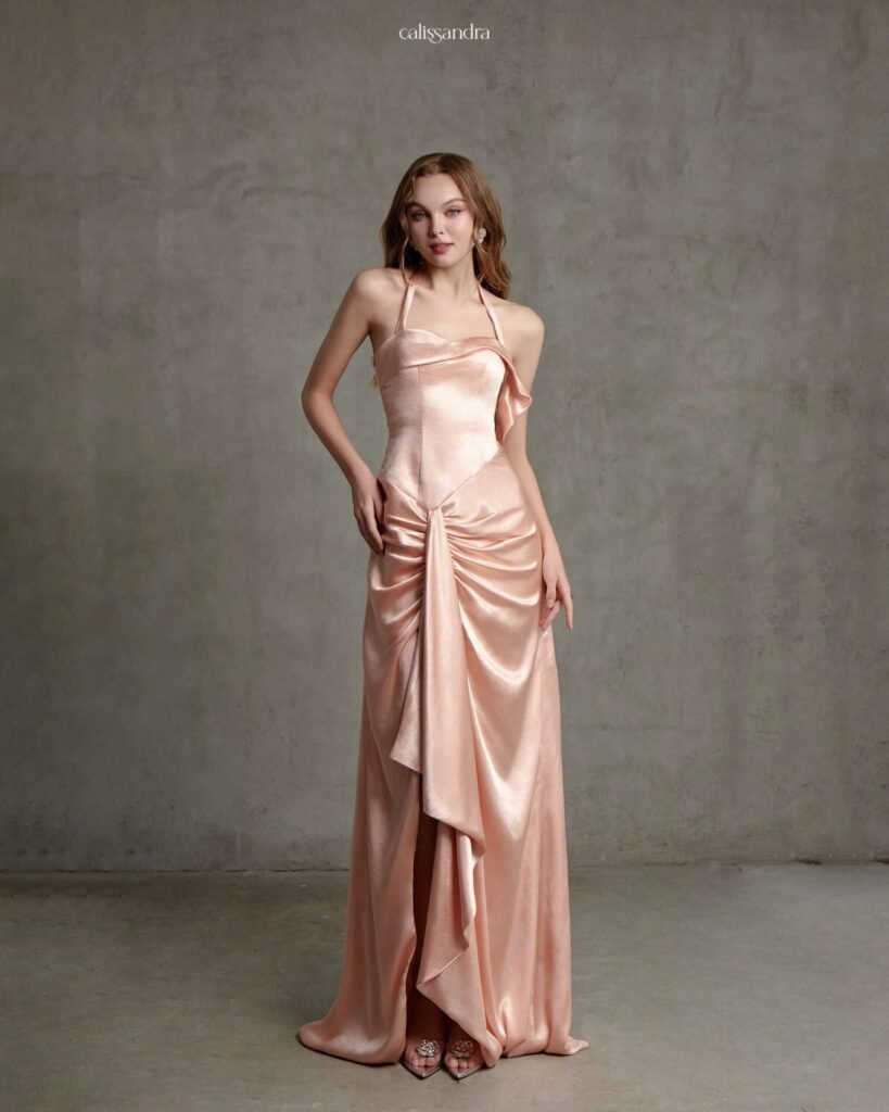 Model wearing the blush peach Calissandra Regelle Dress