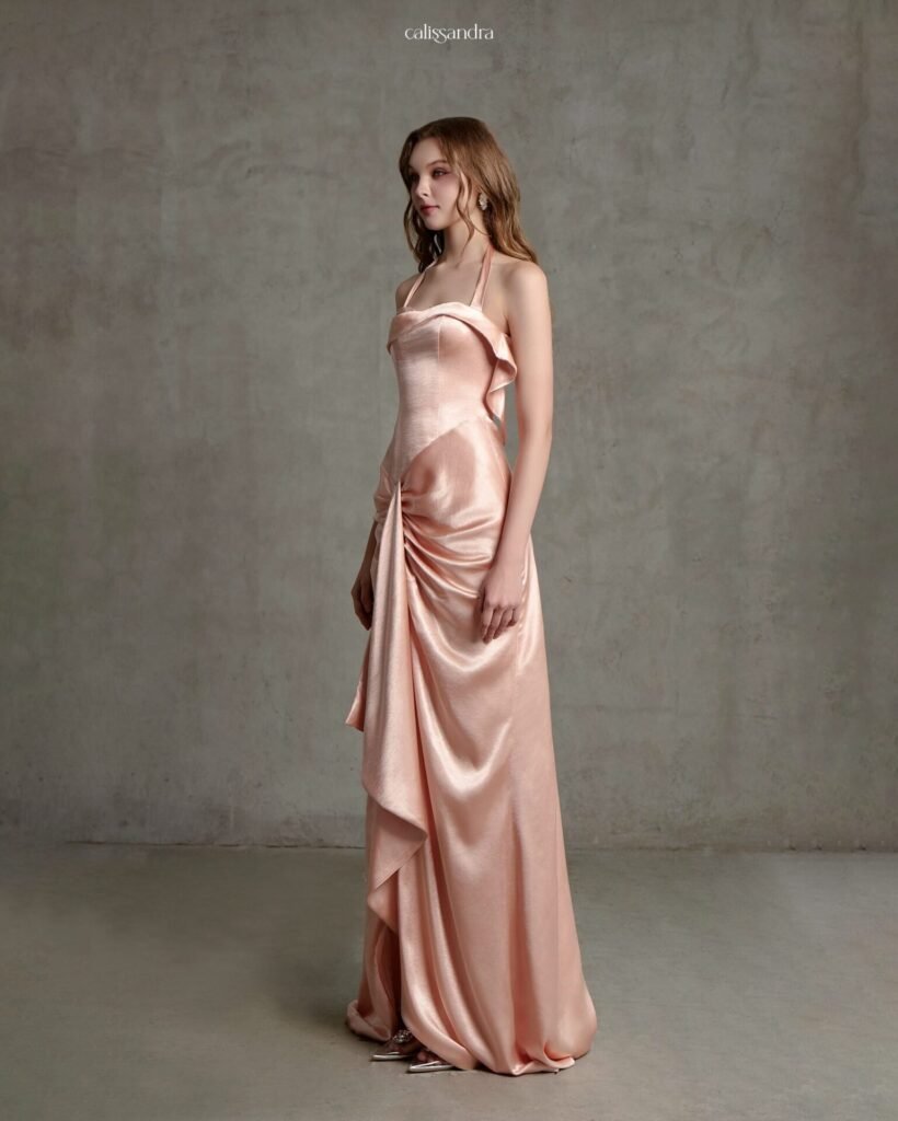 Model wearing the blush peach Calissandra Regelle Dress