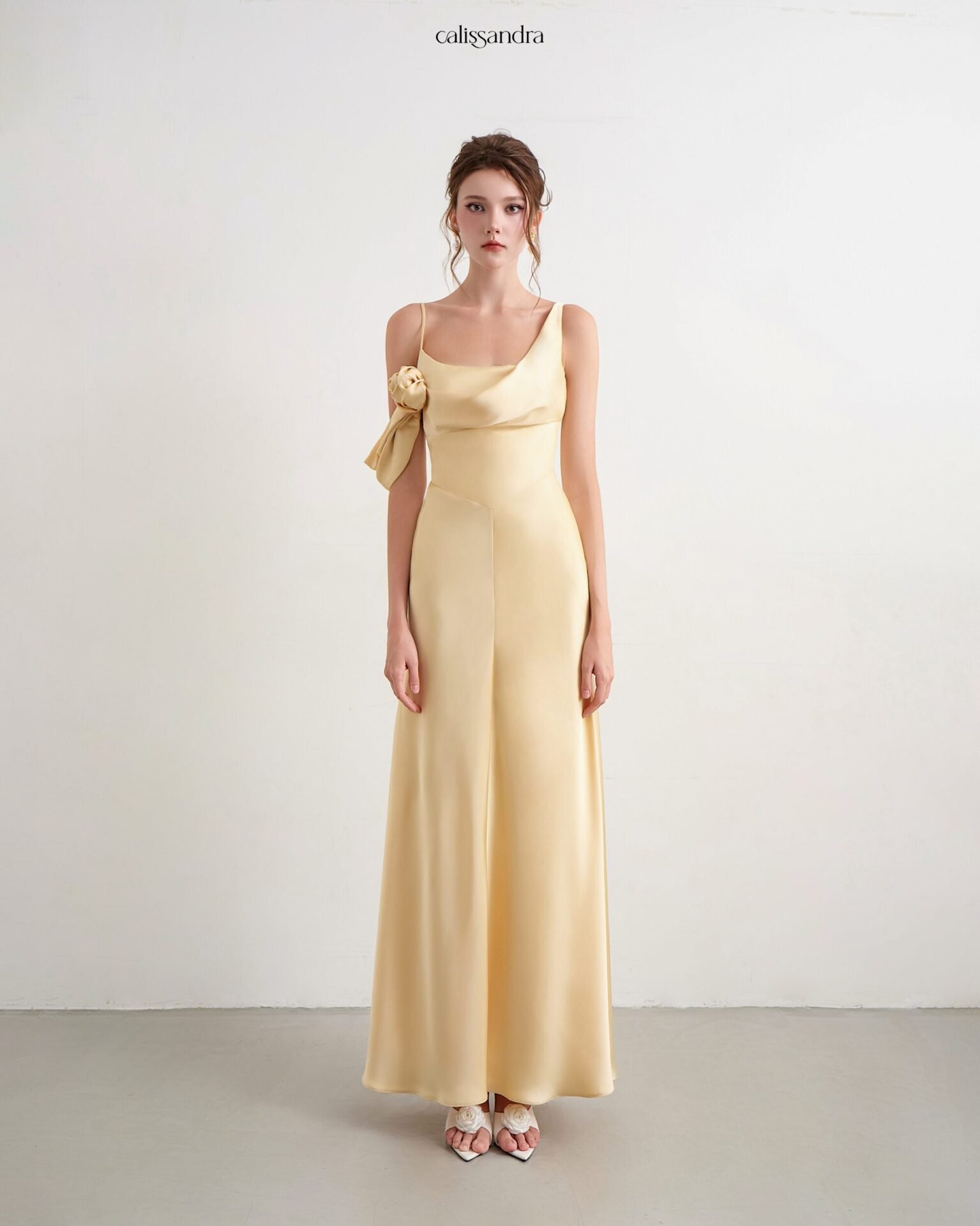 Model wearing the Calissandra Roumaissa Dress in Butter Yellow